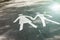 Two silhouettes of a woman and a child on an empty footpath in a park.. Parental Guidance Concept - Pedestrian Sign On The