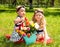 Two sisters. Adorable little child girls with bouquet of flowers on happy birthday.