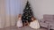 Two sisters in beautiful white dresses dancing together near Christmas tree.