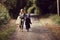 Two sisters dressed up as skeleton and witch going to Halloween party and to trick-or-treat, autumn