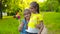 Two sisters girls holding colorful pinwheel