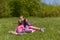 Two sisters had a picnic in a green meadow