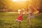 Two sisters holding hands circling