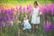 Two sisters holding hands in the flower chain