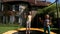 Two sisters jumping on the trampoline