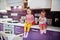 Two sisters kids cooking at kitchen, happy children`s moments