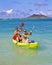 Two sisters paddling a kayak in Hawaii