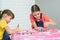 Two sisters play a board game