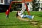 Two sisters playing in the playground, sunny day