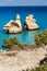 The Two Sisters stacks in front of the shore of Torre dell`Orso