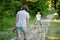 Two sisters on tactile path in barefoot park created to feel the ground and other materials with bare feet. Strengthen foot and