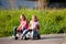 Two sisters with toy cars