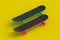 Two skateboards on yellow background