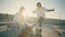 Two skaters dating stadium at summer. Romantic couple kissing at bench closeup