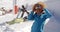 Two skiers with outstretched arms in in the snow