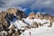 Two skilift cabins in the dolomites over a skier
