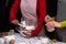 Two Skilled Female Chef in Apron holding ingredient in glass cup mixing