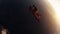 Two skydivers free falling in sky together. Height. Extreme activity. Sunset.