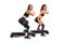 Two slim women in sportswear doing fitness view