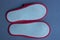 Two slippers made of fabric with a white sole