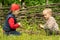 Two small boys having fun building a fire