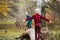 Two small brothers walk on tree trunk