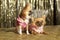 Two small dogs in pink