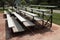 two small empty outdoor silver sports bleacher sets, shot from side angle