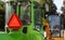 Two small excavators on a large construction site. Bright green on wheels and yellow on tracks. Earthworks and construction.