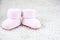 Two small pink booties for babies