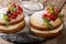 Two small Victoria cake decorated with black and red currants, r