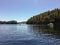 Two small white boats passing through Secret cove, in Smuggler Cove Provincial Marine Park, along the sunshine coast