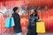 Two Smiling Black Girlfriends Shopping and Chatting