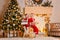 Two smiling child open christmas presents