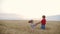 Two smiling children sisters enjoying at the wheat field