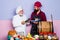 Two smiling male chefs, cooks or bakers. Bearded chef standing in the kitchen of the restaurant. Cook recipe.