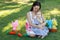 Two smiling sisters: baby and teen girl with chocolate eggs for