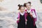 Two Smiling student girl wearing school backpack. Portrait of happy Caucasian young girl outside the primary school