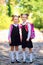 Two Smiling student girl wearing school backpack. Portrait of happy Caucasian young girl outside the primary school