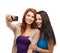 Two smiling teenagers with smartphone