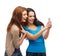 Two smiling teenagers with smartphone