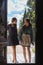 Two smiling women at door entrance