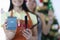 Two smiling women hairdressers in uniforms hold 2022 calendar and scissors with a comb