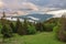 Two snowcats, view from chalet under Suchy, national park Mala Fatra, Slovakia, spring sunset time