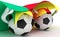 Two soccer balls hold Cameroon flag