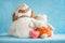 Two soft toy dog and rabbit embrace and a pink knitted heart on