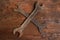 Two spanners wooden background service maintenance