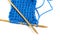 Two spokes with knit blue woolen cloth isolated macro