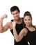 Two sportive people showing their biceps