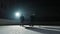 Two sportsmen hockey players who are sliding on ice arena and dribbles, hitting puck with stick. Young guys in uniforms